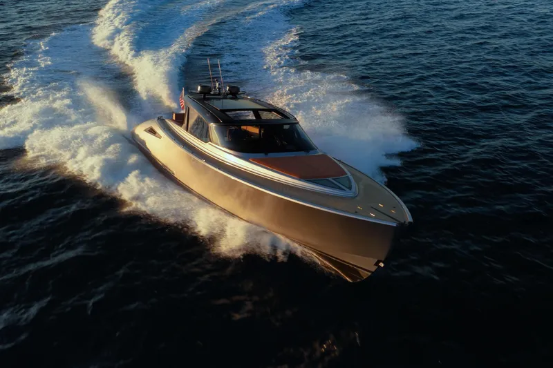 Why Her Yacht Photos Pics 2024 Wajer 55 HT luxury yacht cruising on open water at sunset.