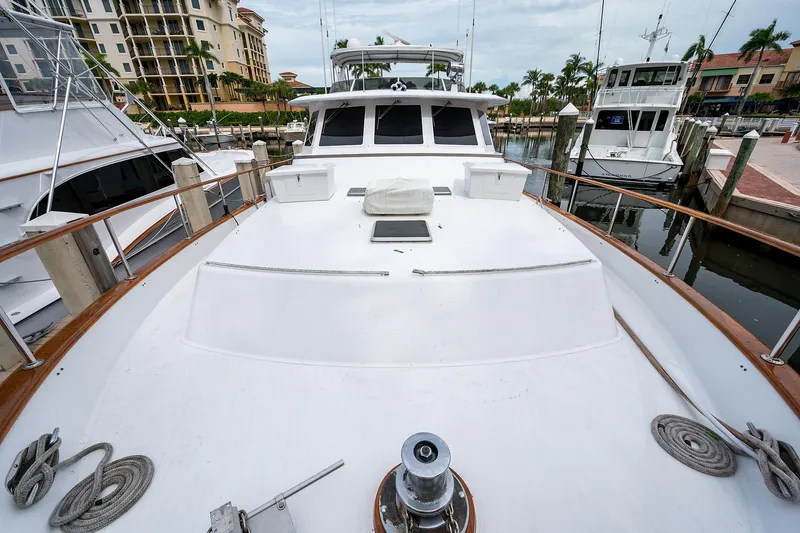 Motivated Seller Yacht Photos Pics 1986 Tollycraft Pilothouse yacht docked at marina, front deck view.