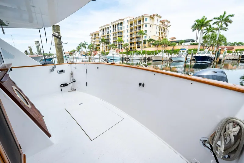 Motivated Seller Yacht Photos Pics 1986 Tollycraft Pilothouse yacht deck with marina view.