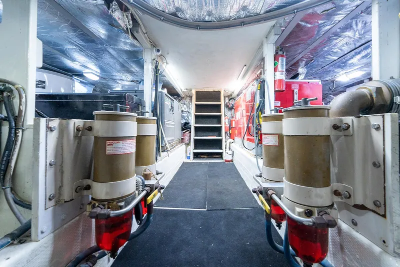 Motivated Seller Yacht Photos Pics 1986 Tollycraft Pilothouse engine room with fuel filters and equipment.