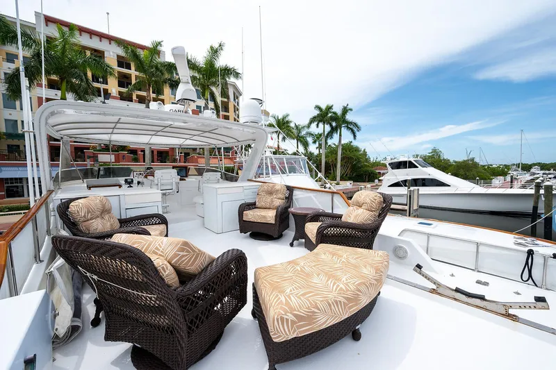 Motivated Seller Yacht Photos Pics 1986 Tollycraft Pilothouse yacht with outdoor seating area in marina.