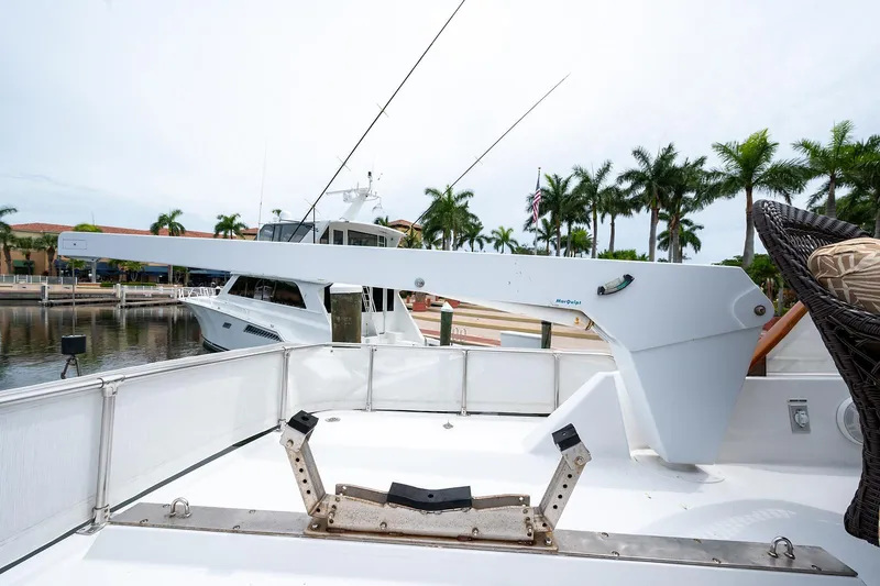 Motivated Seller Yacht Photos Pics 1986 Tollycraft Pilothouse yacht docked at a marina with palm trees in the background.