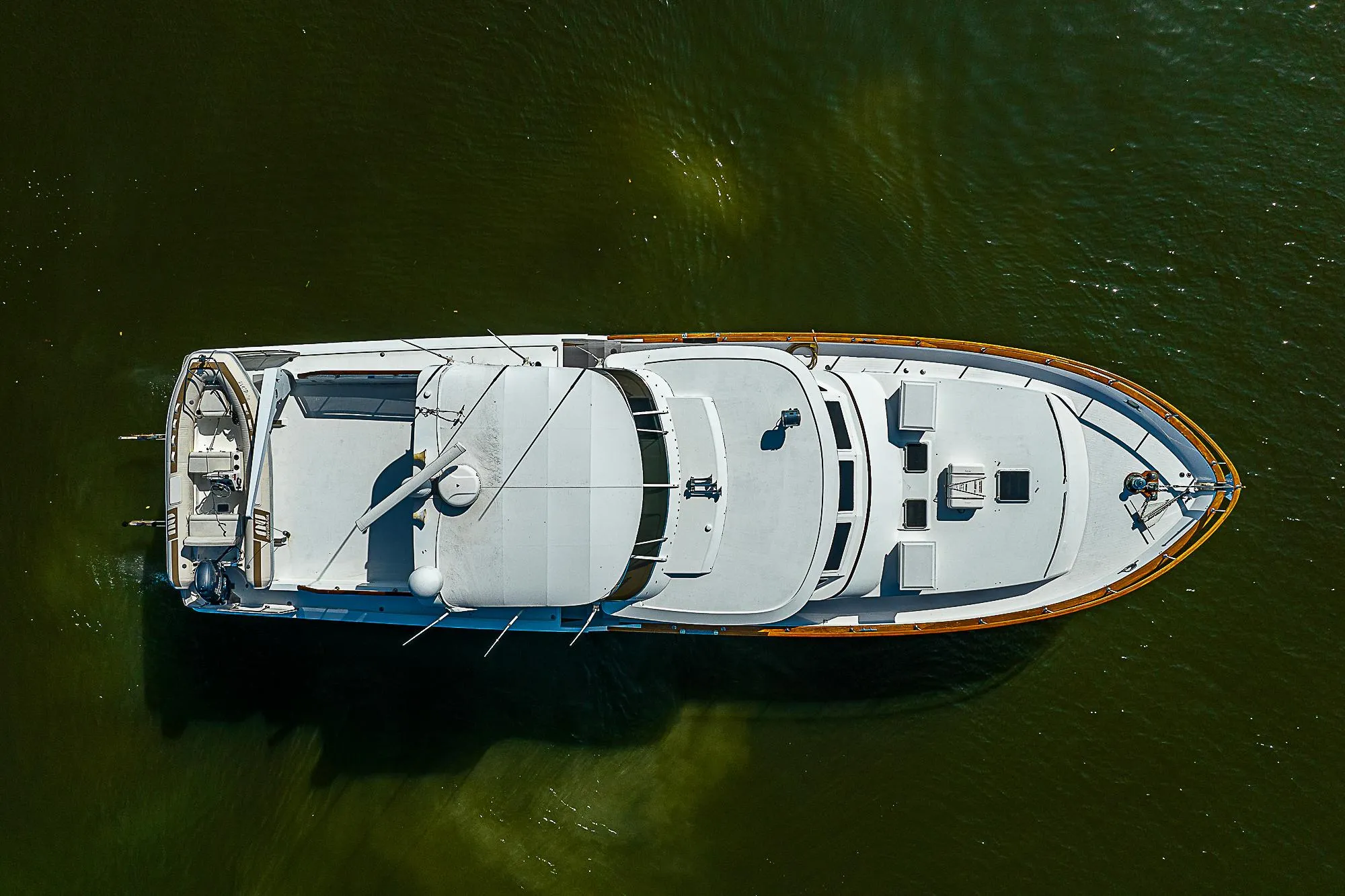 1986 Tollycraft Pilothouse yacht, aerial view on water.