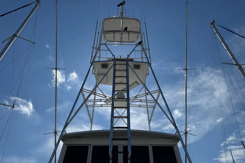  Yacht Photos Pics 1995 Viking 58 Convertible yacht tower against a clear blue sky.