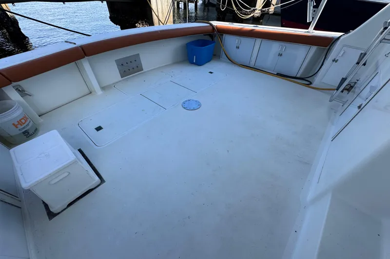  Yacht Photos Pics Spacious deck of 1995 Viking 58 Convertible yacht with seating and storage.