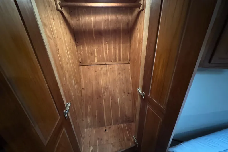  Yacht Photos Pics Wooden closet interior on a 1995 Viking 58 Convertible boat.