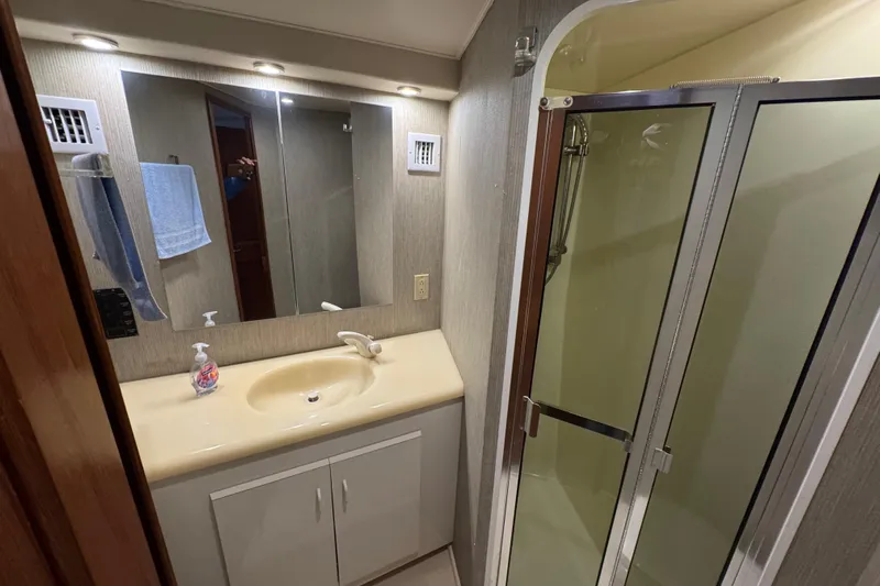  Yacht Photos Pics Bathroom interior of 1995 Viking 58 Convertible yacht with shower and vanity.