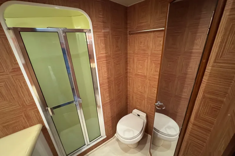  Yacht Photos Pics Bathroom interior of 1995 Viking 58 Convertible yacht with shower and toilet.