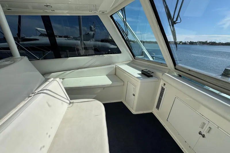  Yacht Photos Pics Interior view of 1995 Viking 58 Convertible yacht with seating and ocean view.