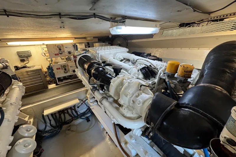  Yacht Photos Pics Engine room of a 1995 Viking 58 Convertible yacht, showcasing machinery and equipment.