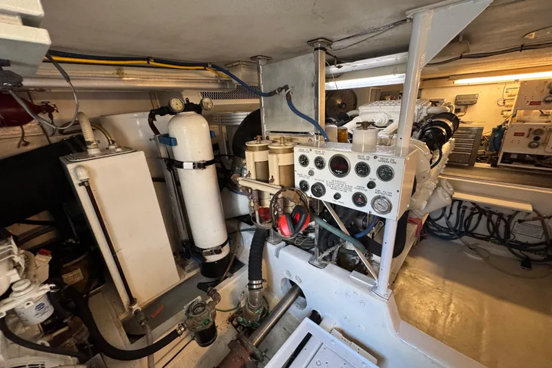  Yacht Photos Pics Engine room of a 1995 Viking 58 Convertible yacht, showcasing machinery and control panels.