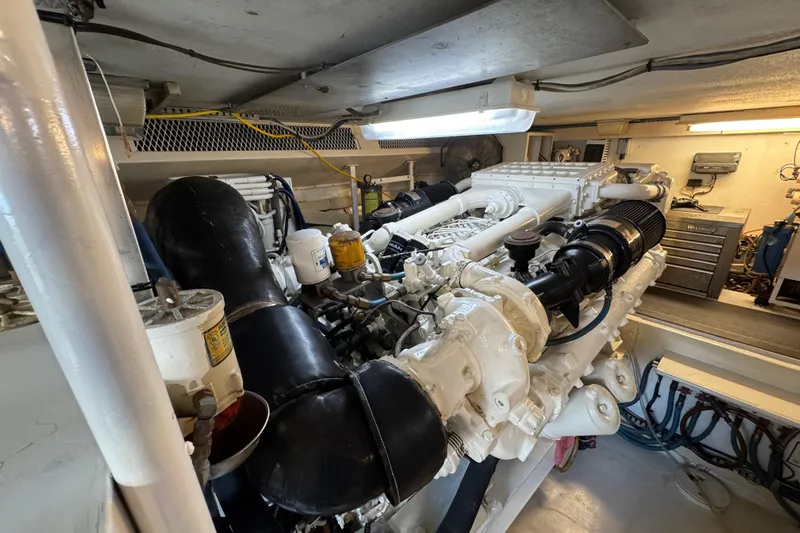  Yacht Photos Pics Engine room of a 1995 Viking 58 Convertible yacht, showcasing detailed machinery.