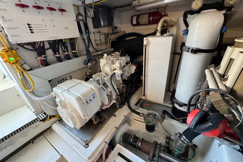  Yacht Photos Pics Engine room of a 1995 Viking 58 Convertible yacht, showcasing mechanical components and wiring.