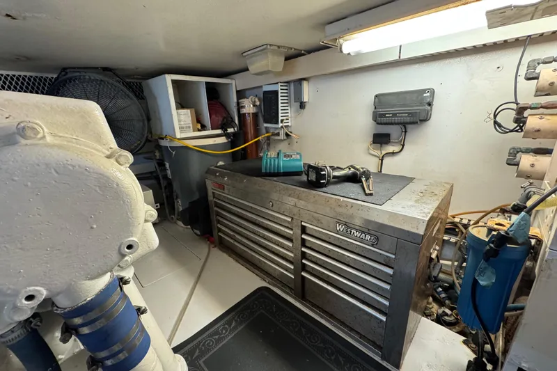  Yacht Photos Pics Engine room of a 1995 Viking 58 Convertible with tools and equipment.