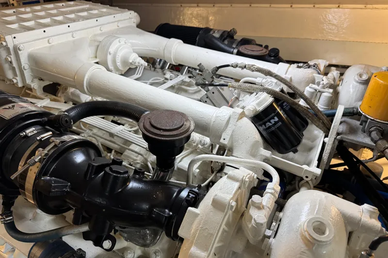  Yacht Photos Pics Engine of a 1995 Viking 58 Convertible boat, showcasing detailed mechanical components.