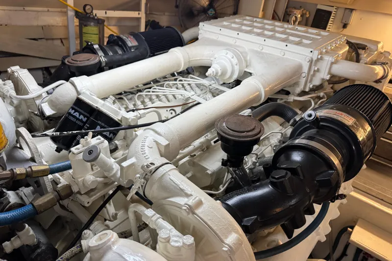  Yacht Photos Pics Engine room of a 1995 Viking 58 Convertible yacht, showcasing detailed machinery components.