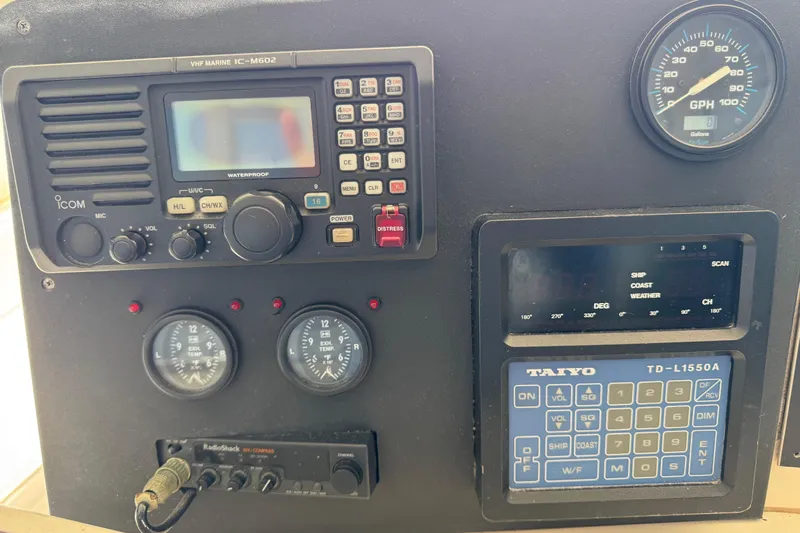  Yacht Photos Pics Control panel of a 1995 Viking 58 Convertible boat with various gauges and equipment.