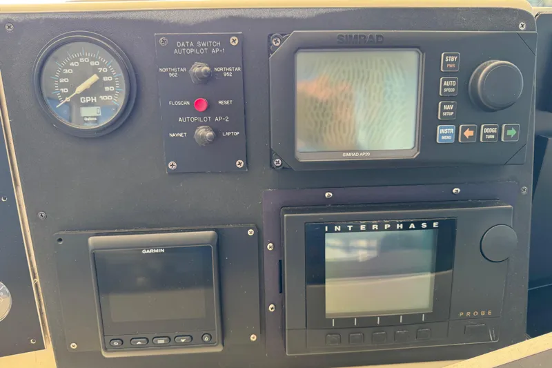  Yacht Photos Pics Control panel of a 1995 Viking 58 Convertible boat with navigation instruments.