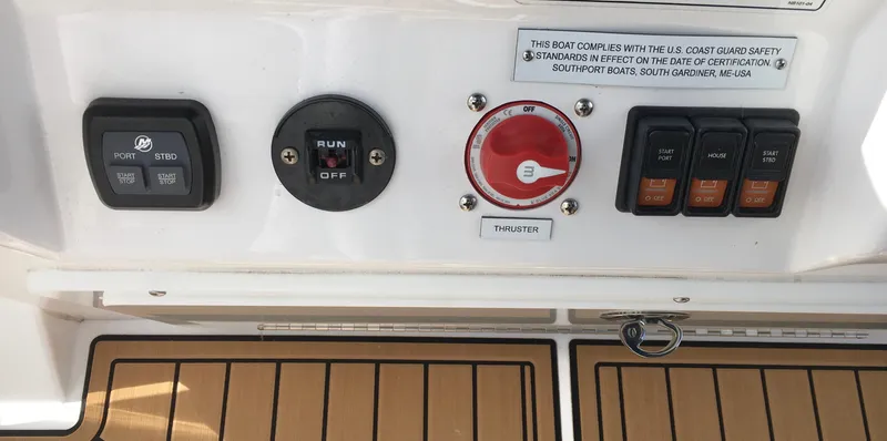  Yacht Photos Pics Control panel of a 2020 Southport 33 FE boat with switches and dials.