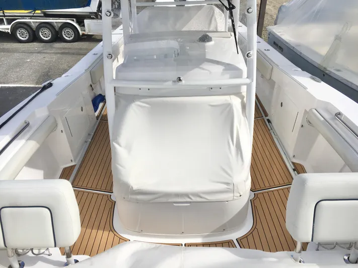  Yacht Photos Pics 2020 Southport 33 FE boat interior with teak flooring and white seating.