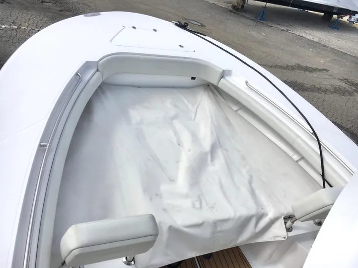  Yacht Photos Pics 2020 Southport 33 FE boat bow with white seating and cover.