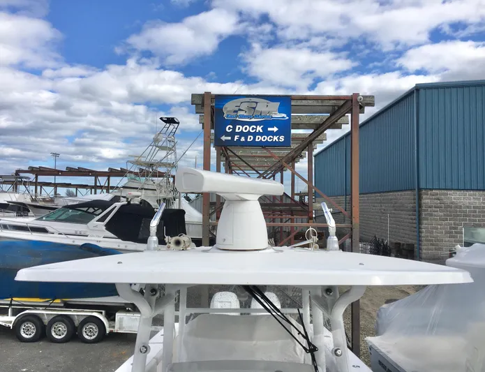  Yacht Photos Pics 2020 Southport 33 FE boat at marina with dock signs and blue sky.