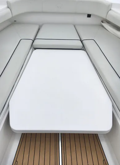  Yacht Photos Pics 2020 Southport 33 FE boat interior with white seating and wooden flooring.