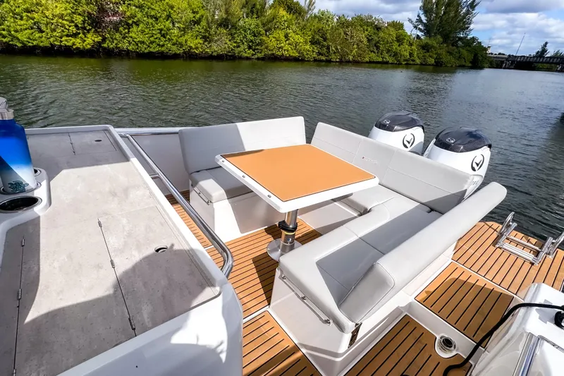  Yacht Photos Pics 2025 STERK 31 boat with modern seating and dual engines on a scenic river.