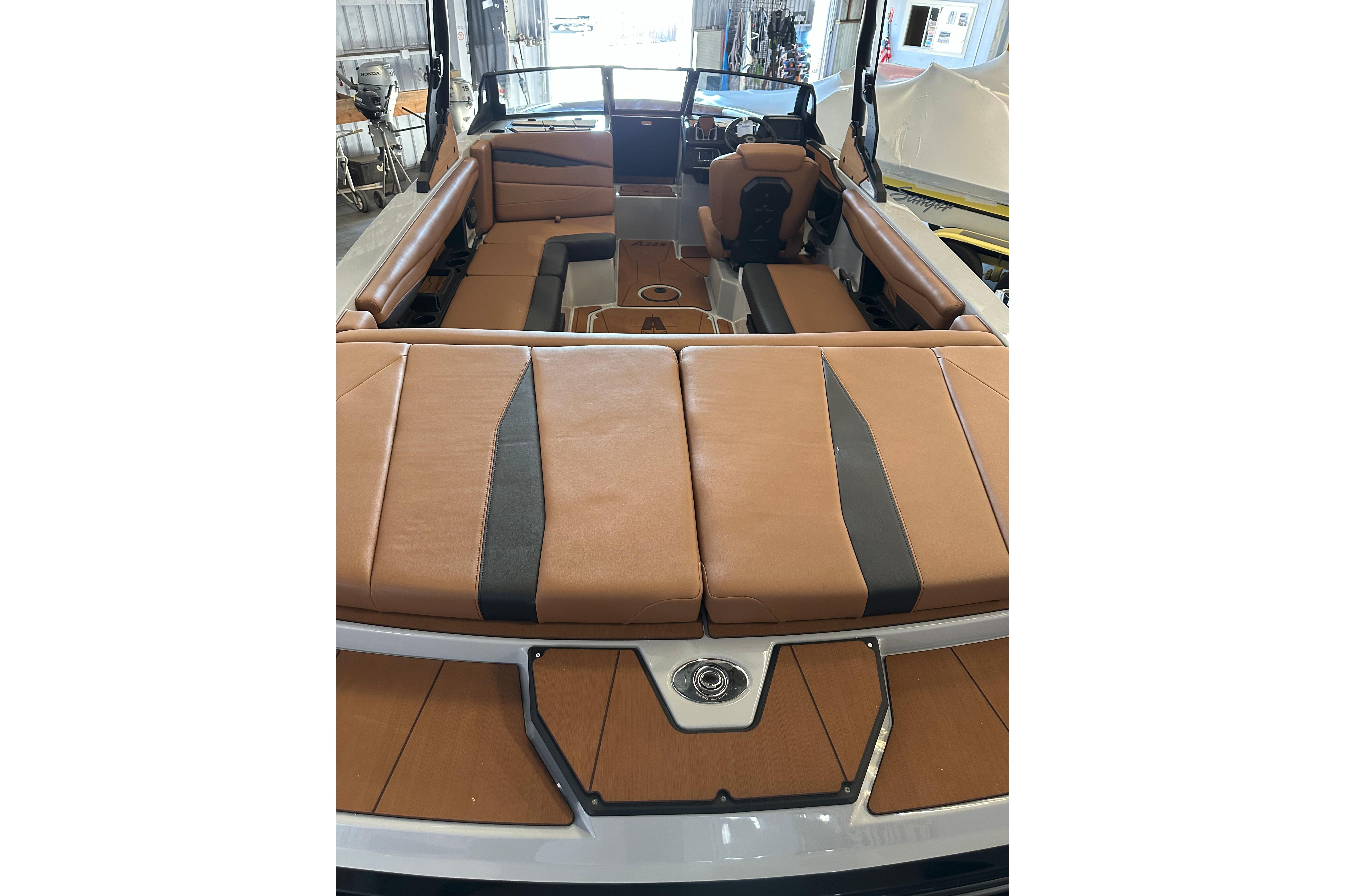 2026 Axis A225 boat interior with tan leather seating and modern design.