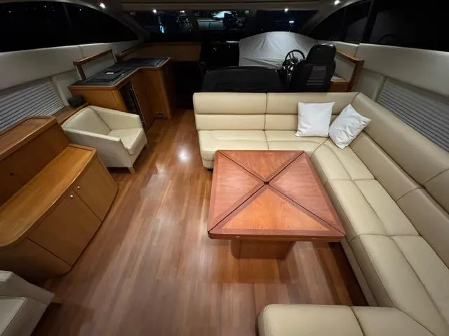Joško Marić Yacht Photos Pics Luxurious interior of 2008 Sunseeker Predator 72 yacht with elegant seating and wooden accents.