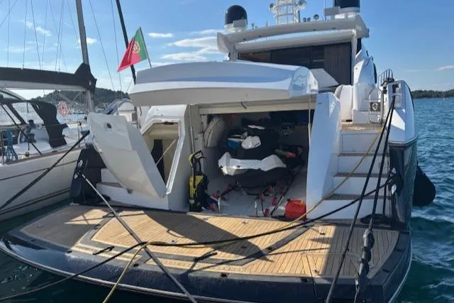 Joško Marić Yacht Photos Pics 2008 Sunseeker Predator 72 yacht docked, rear view with open storage compartment.