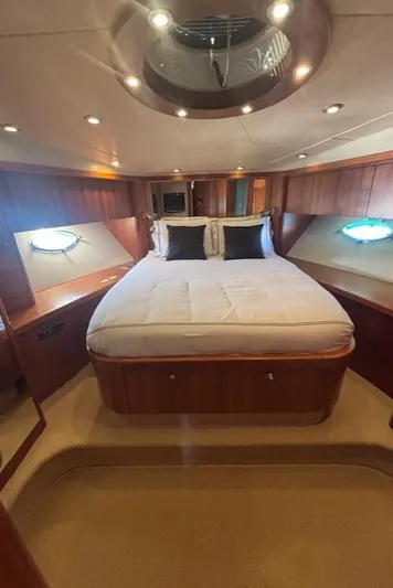 Joško Marić Yacht Photos Pics Luxurious cabin interior of 2008 Sunseeker Predator 72 yacht with elegant wood finish.