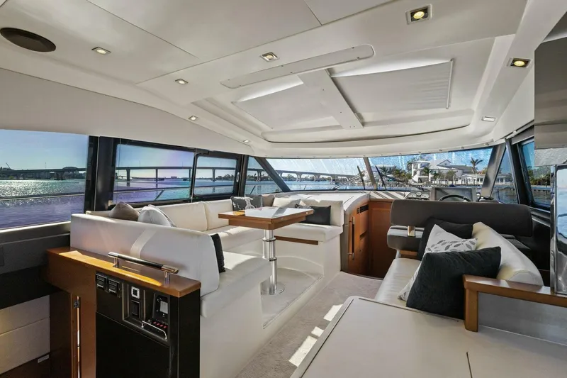Slainte Yacht Photos Pics Luxurious interior of 2014 Prestige 450 S yacht with elegant seating and panoramic windows.