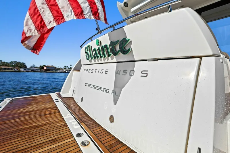 Slainte Yacht Photos Pics Prestige 450 S yacht, 2014 model, docked with American flag, St. Petersburg, FL.