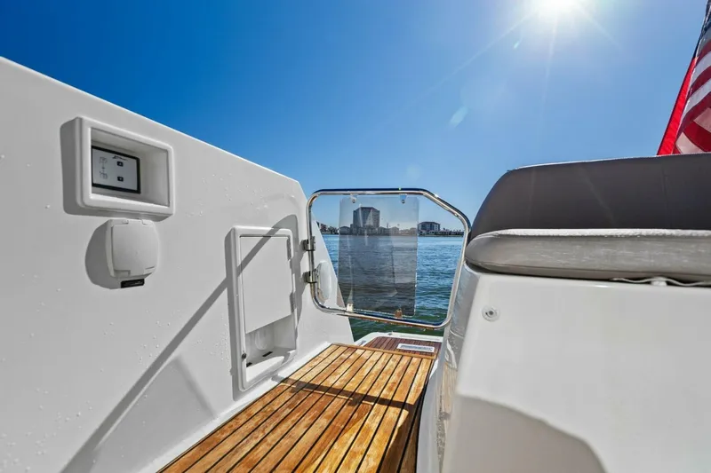 Slainte Yacht Photos Pics Prestige 450 S yacht deck view, 2014 model, overlooking water and cityscape.