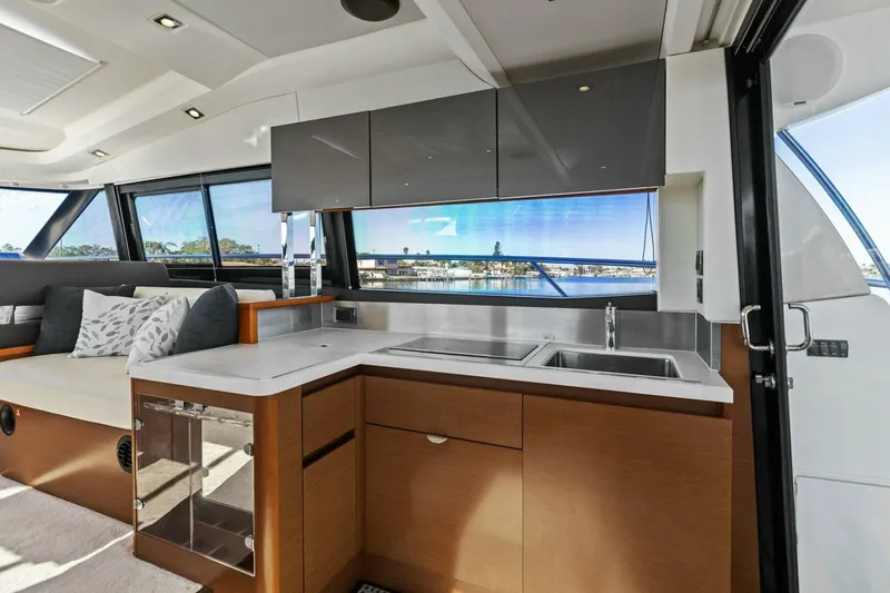 Slainte Yacht Photos Pics Luxurious 2014 Prestige 450 S yacht interior with modern kitchen and scenic views.