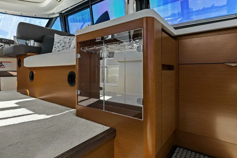 Slainte Yacht Photos Pics Interior of 2014 Prestige 450 S yacht with modern wood cabinetry and seating.