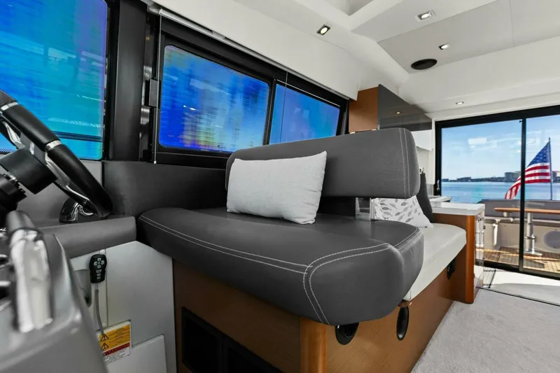Slainte Yacht Photos Pics Interior of 2014 Prestige 450 S yacht with modern seating and ocean view.