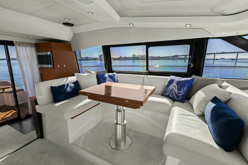 Slainte Yacht Photos Pics Luxurious interior of 2014 Prestige 450 S yacht with elegant seating and scenic views.
