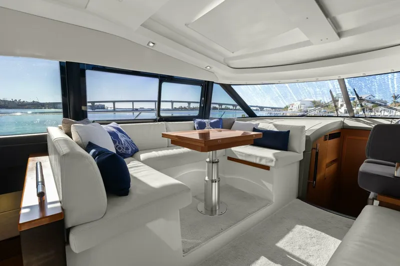 Slainte Yacht Photos Pics Luxurious interior of 2014 Prestige 450 S yacht with elegant seating and panoramic windows.