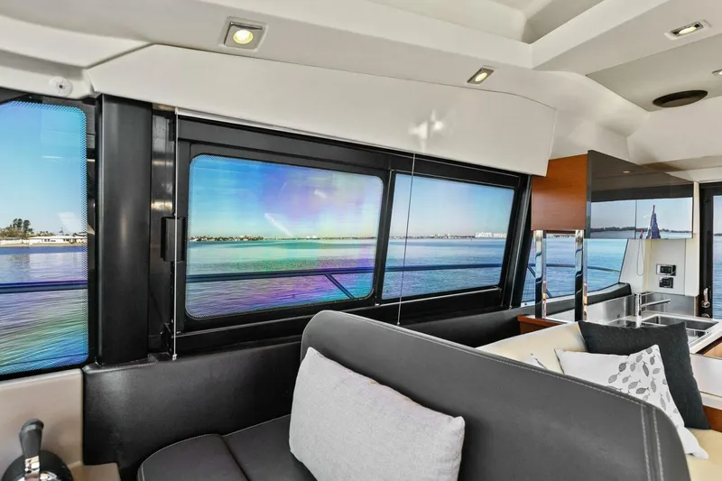 Slainte Yacht Photos Pics Interior of 2014 Prestige 450 S yacht with scenic ocean view through windows.