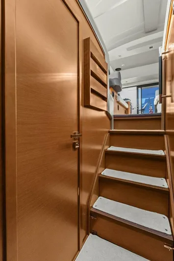 Slainte Yacht Photos Pics Interior stairs of 2014 Prestige 450 S yacht, featuring wooden finish and modern design.