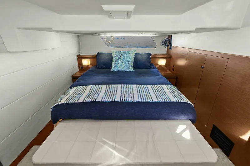 Slainte Yacht Photos Pics Luxurious cabin interior of 2014 Prestige 450 S yacht with cozy bedding.