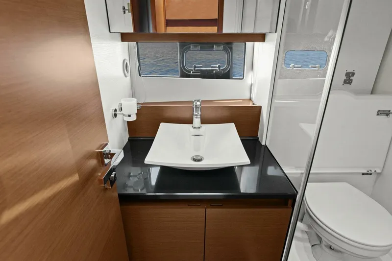 Slainte Yacht Photos Pics Luxurious bathroom in 2014 Prestige 450 S yacht with modern sink and toilet.