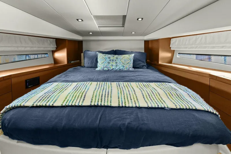 Slainte Yacht Photos Pics Luxurious bedroom interior of 2014 Prestige 450 S yacht with cozy bedding.