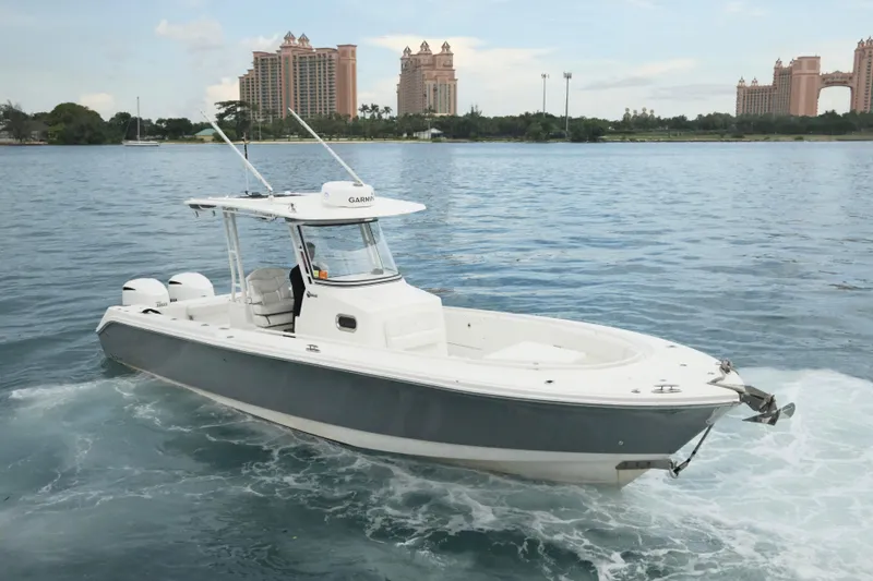  Yacht Photos Pics 2019 Edgewater Prince boat cruising on water with cityscape in background.