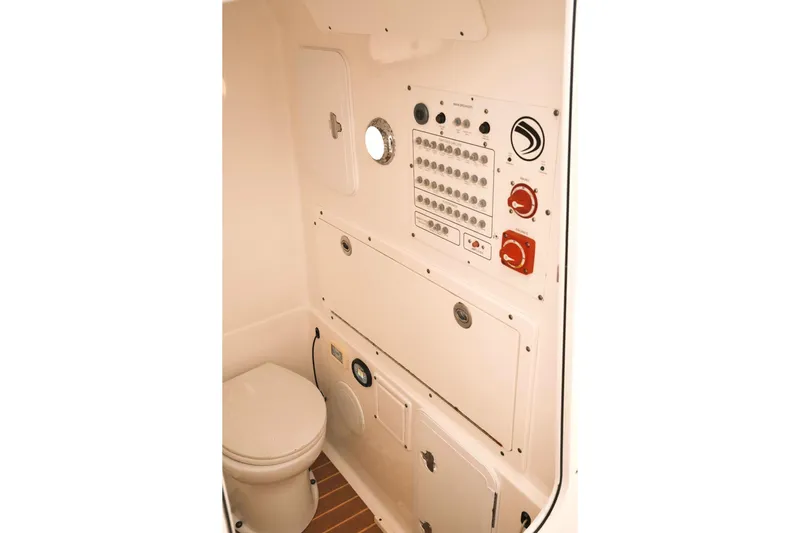  Yacht Photos Pics 2019 Edgewater Prince boat interior with control panel and marine toilet.
