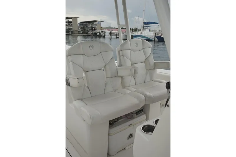  Yacht Photos Pics Luxurious white seating on 2019 Edgewater Prince boat, docked at marina.