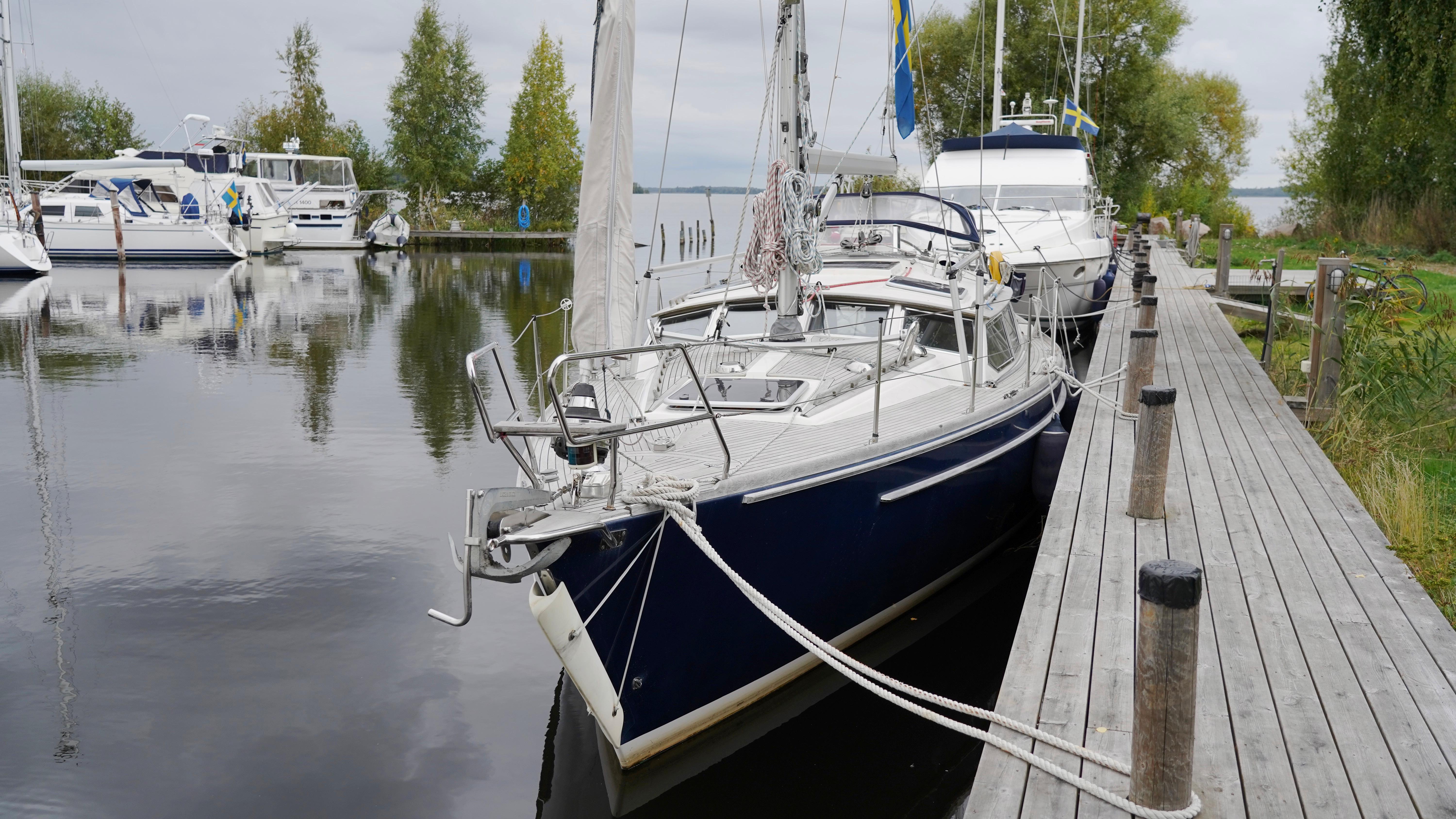 Sailboat docked at a serene marina, CR 400 DS, 2002 model.