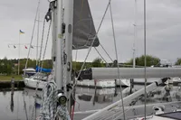Sailboat mast and rigging of 2002 CR 400 DS in a marina setting.